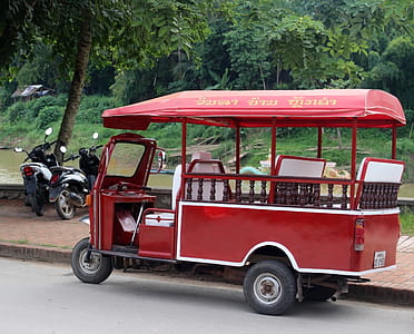 Red Tuk Tuk motorcycle taxi in Laos, south-east Asia thumbnail