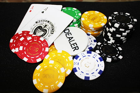 pile and stack of assorted-color poker chips beside Ace of Spades and Diamonds thumbnail