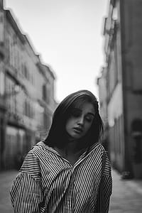 grayscale photo of woman wearing striped shisrt thumbnail