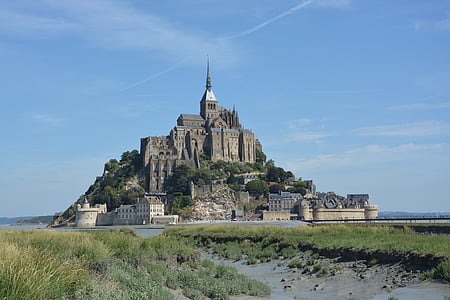 gray castle surrounded by grass thumbnail