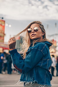 Woman Playing With Blonde Hair Photo thumbnail