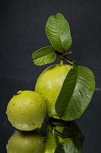 green guava fruit on black surface thumbnail
