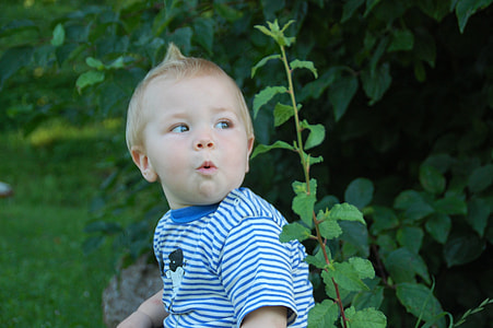 closeup photo of baby in blue and white striped shirt thumbnail