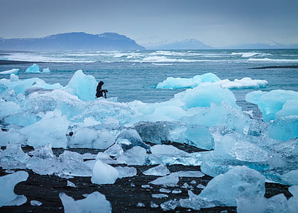 person on ice during daytime thumbnail