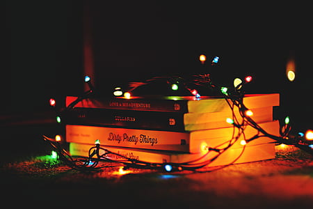 black string lights on top of books thumbnail