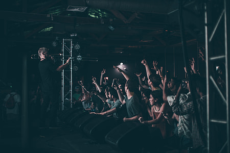 crowd of people cheering during concert thumbnail