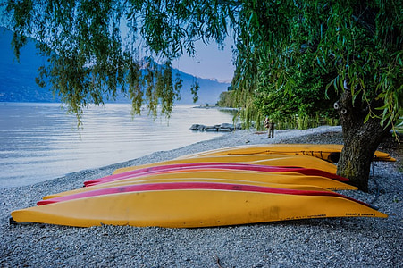 yellow canoes on shore thumbnail