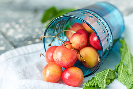 cherry inside drinking glass in focus photography thumbnail