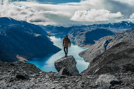 person standing on cliff thumbnail
