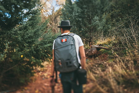 selective focus photography of man about to climb thumbnail