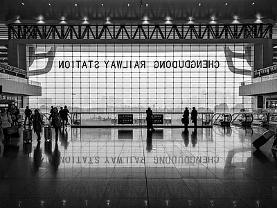 grayscale photo of airport interior thumbnail