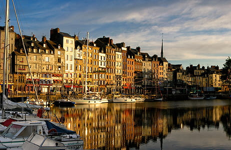 pier and buildings near body of water thumbnail