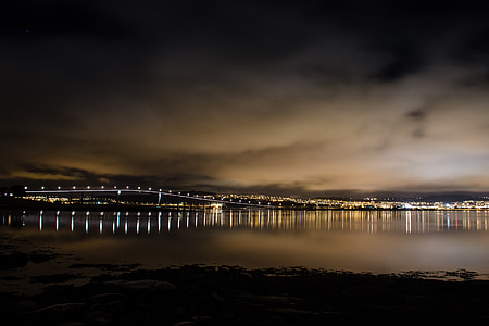 night light buildings and bridge with mirror reflection photography thumbnail