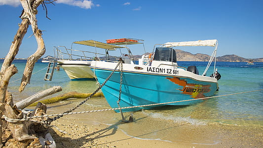 two boats docked near driftwood thumbnail