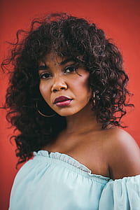 woman wearing blue off-shoulder top in closeup photography thumbnail