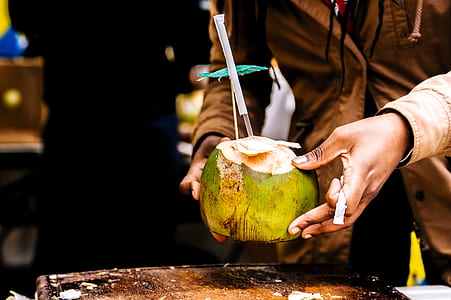 Person Holding Coconut thumbnail