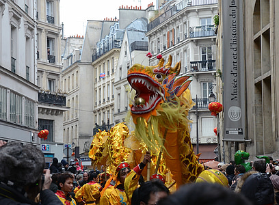 dragon dance at the middle of high-rise buildings thumbnail