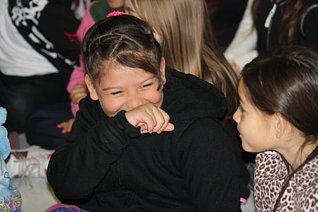 smiling girl talking to girl wearing leopard shirt thumbnail