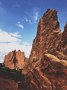 brown rock formations under blue sky thumbnail