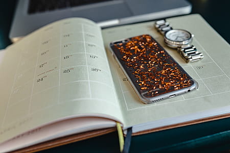 Home office desk with Macbook, iPhone, calendar, watch & organizer thumbnail