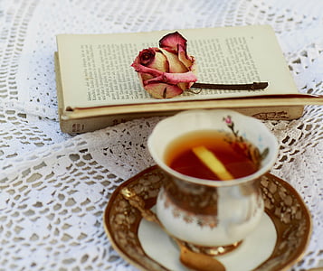 white and brown ceramic teacup with spoon and saucer thumbnail
