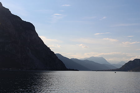photograph of mountains beside body of water thumbnail