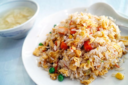 fried rice with mixed vegetables on white ceramic plate thumbnail