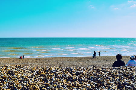 people on seashore during daytime thumbnail
