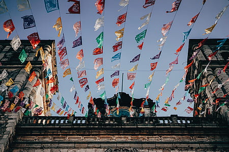 assorted-color buntings on building thumbnail