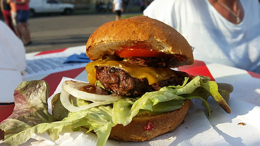 food photography of beef patty burger with cheddar cheese slice and lettuce thumbnail