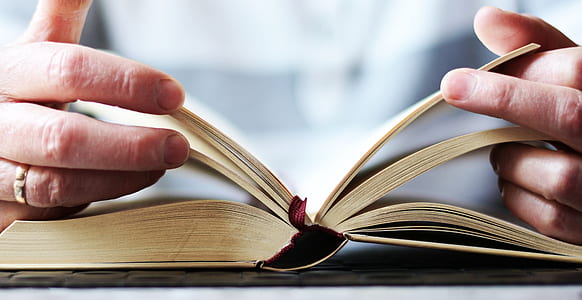 person opening a book thumbnail