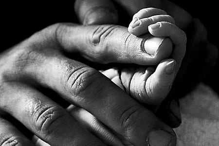 grayscale photography of human fingers thumbnail
