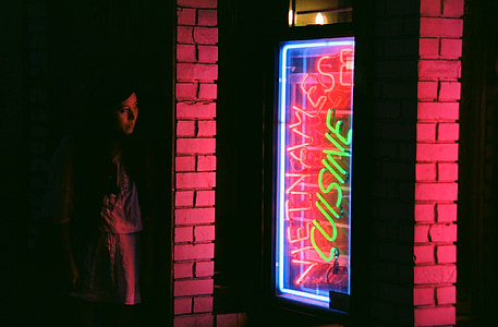 woman staring at the neon signage thumbnail