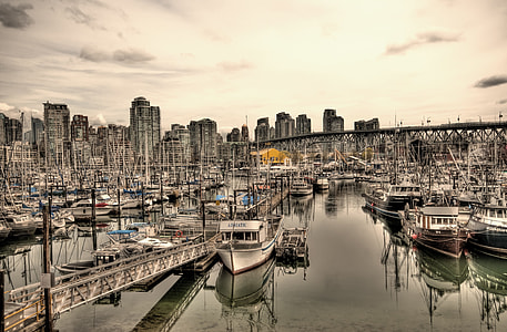 grayscale photo of boats in body of water thumbnail