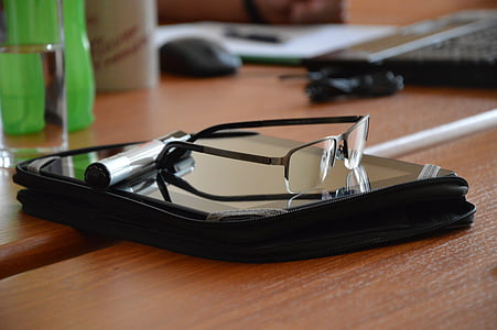 black framed eyeglasses on tablet computer thumbnail