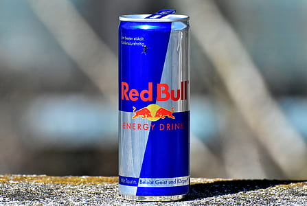 shallow focus photography of blue and gray Red Bull energy drink tin can thumbnail
