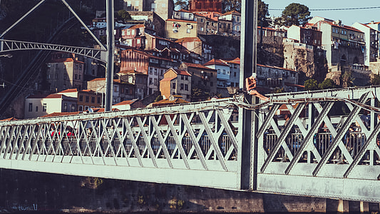 gray metal bridge near town thumbnail