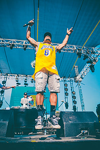 man standing on stadium during daytime thumbnail