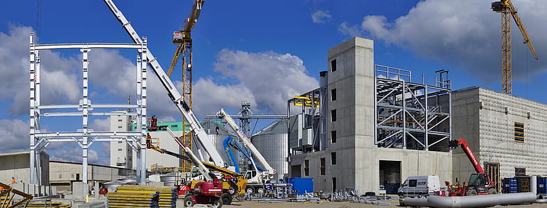 gray concrete building under cloudy sky during daytime thumbnail