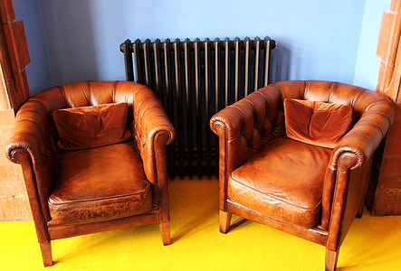 two brown leather armchairs inside the room thumbnail