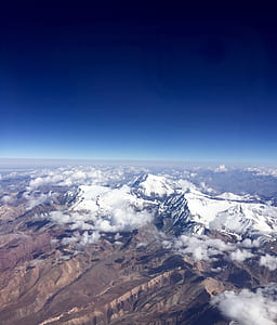 aerial photography of mountain covered snow at daytime thumbnail