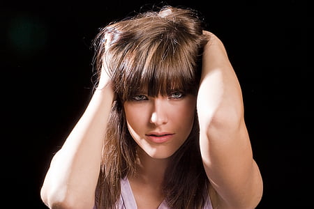 woman holding her hair thumbnail