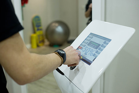 person about to touch digital monitor thumbnail