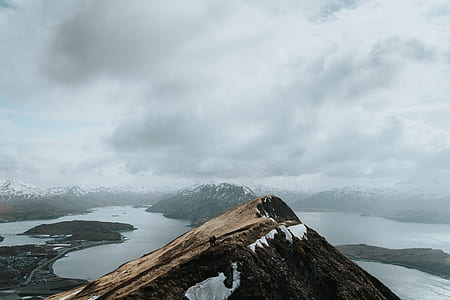 aerial photography of mountain covered with snow during daytime thumbnail