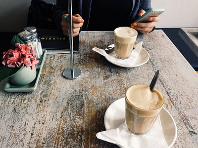 two cappuccino on white ceramic saucers thumbnail