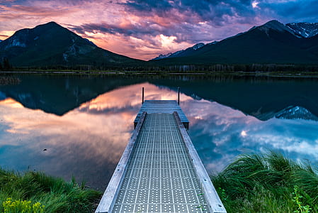 gray steel dock near gray mountains thumbnail