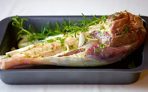 raw meat filled with vegetable on gray pan thumbnail