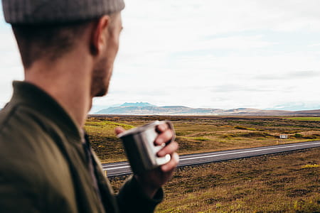 Man Watching The Road Landscape Photo thumbnail