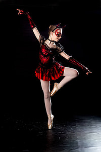 girl wearing black and red dress dancing ballet thumbnail