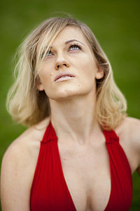 woman wearing halterneck top looking upward thumbnail